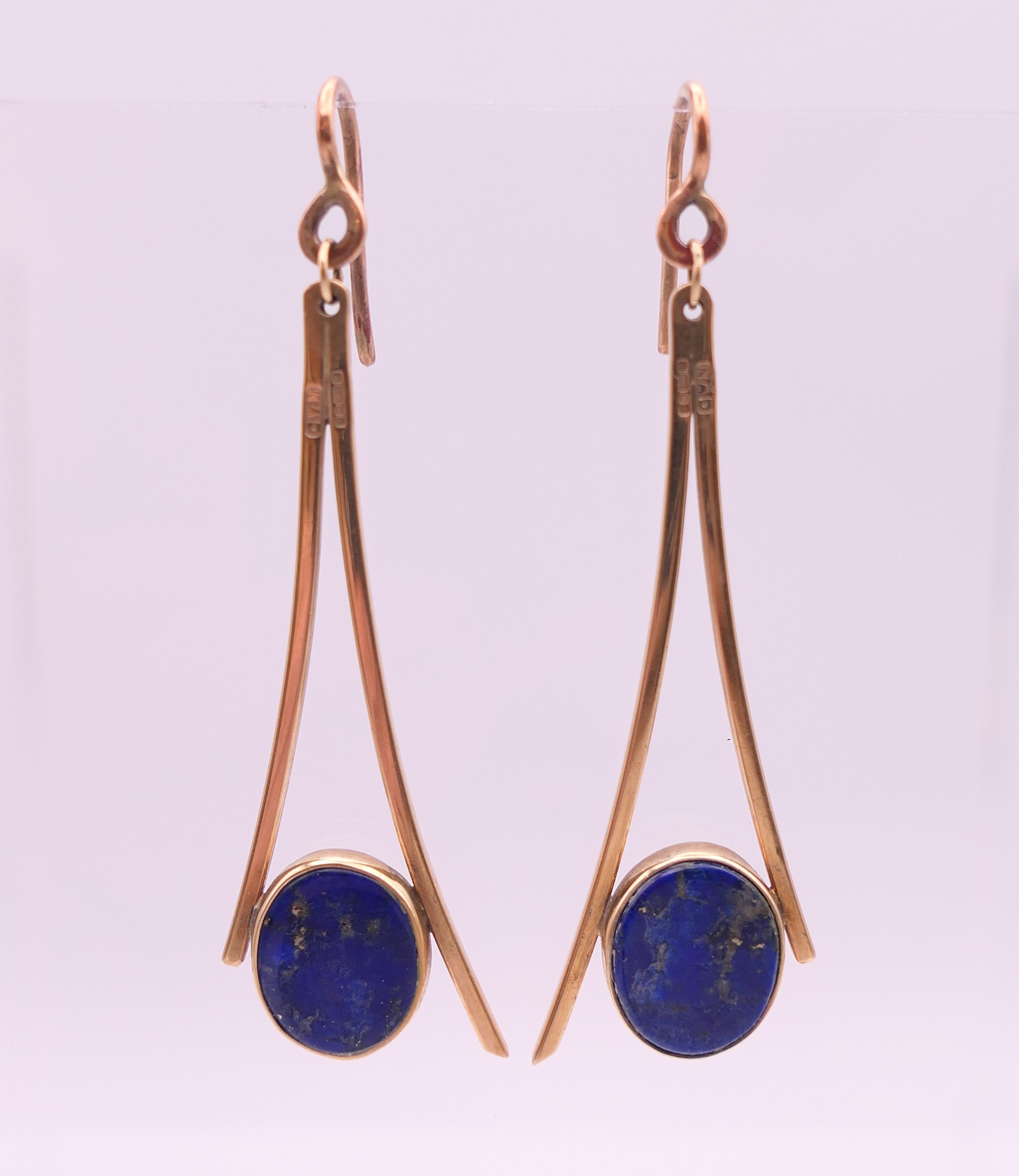 A pair of 9 ct gold and lapis drop earrings. 4.5 cm high. 5.9 grammes total weight.