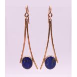A pair of 9 ct gold and lapis drop earrings. 4.5 cm high. 5.9 grammes total weight.