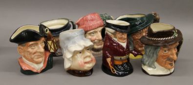 A quantity of various character jugs.