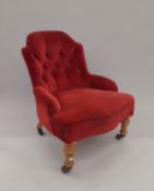 A Victorian red velvet upholstered nursing chair. 58 cm wide.