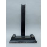 An ebonised plate stand. 56 cm high.