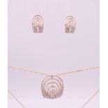 A pair of 9 ct gold and diamond earrings and a matching pendant necklace. Earrings 1.