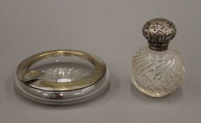 A silver mounted ash tray and a silver topped scent bottle. The former 11.5 cm diameter.