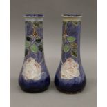 A pair of Royal Doulton vases. 24.5 cm high.