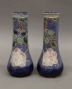 A pair of Royal Doulton vases. 24.5 cm high.