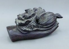 A model of a hand holding a flower. 25 cm long.