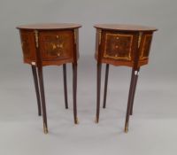 A pair of oval two drawer side tables. 98 cm wide.