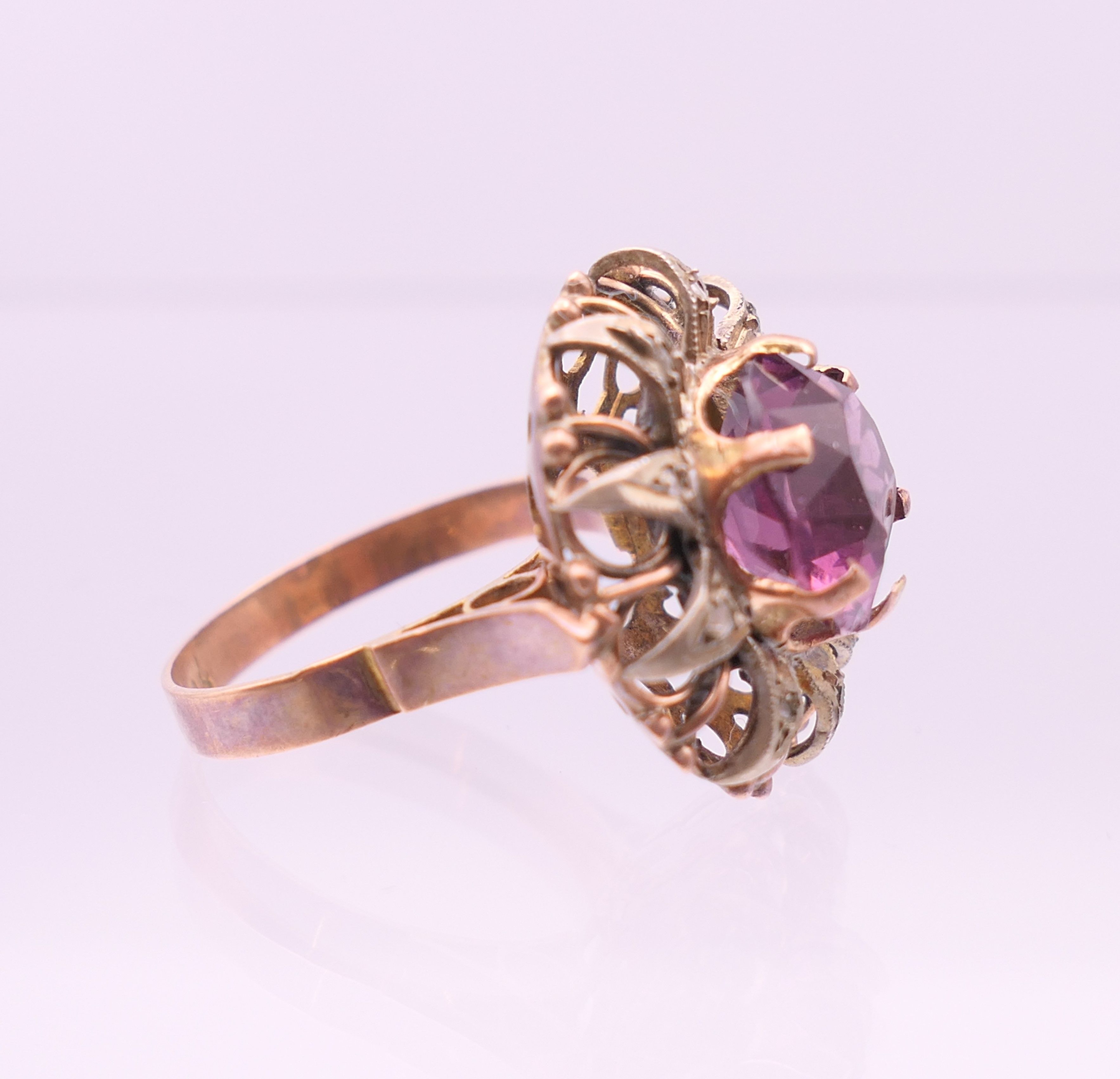 A 9 ct gold, amethyst and diamond flowerhead ring. Ring size Q. - Image 3 of 6