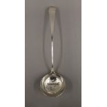 A Georgian silver ladle. 34 cm long. 165.2 grammes.