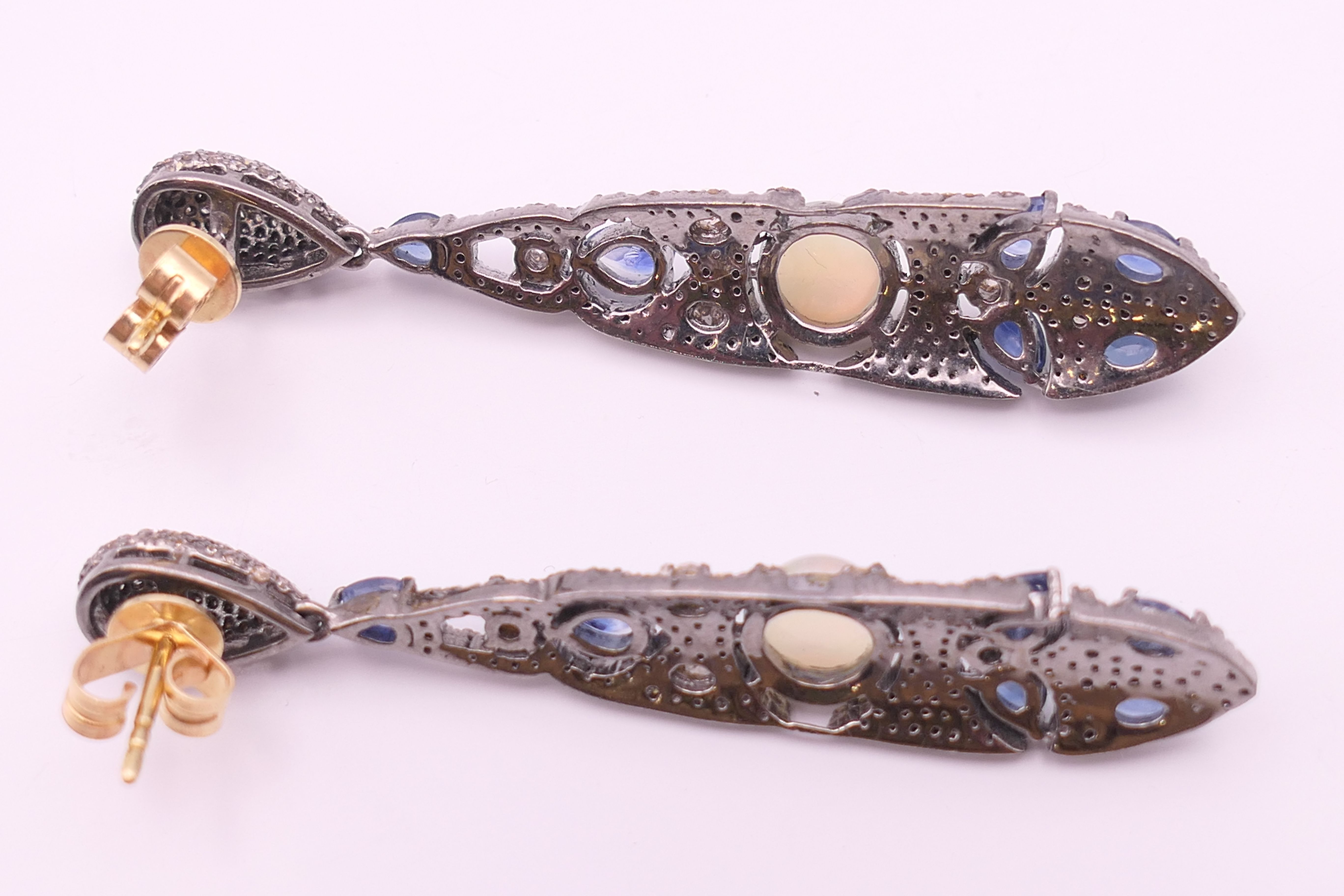 A pair of opal, diamond and sapphire earrings. 5.75 cm high. - Image 6 of 7