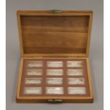 A boxed set of 12 Royal Palaces silver ingots. Each 31.3 grammes.