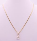 A 14 ct gold necklace and pendant. Pendant 1.5 cm high, chain 44 cm long. 5.7 grammes total weight.
