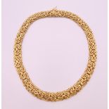 An 18 ct gold twist form necklace. 45.5 cm long. 80.5 grammes.