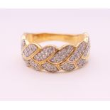 A silver gilt and cubic zirconia ring. Ring size R/S.