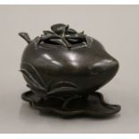 A Chinese bronze peach form censer on stand. 9.5 cm high overall.
