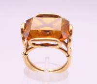 A gold and topaz or citrine ring. Ring size N/O.
