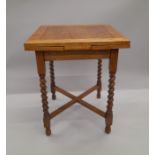 A small early 20th century oak barley twist drawer leaf table. 61.5 x 60 cm closed.