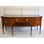 A line inlaid cross banded mahogany bow front sideboard with brass gallery. 184 cm wide.