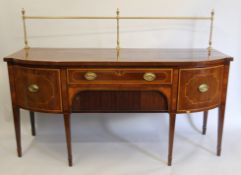 A line inlaid cross banded mahogany bow front sideboard with brass gallery. 184 cm wide.