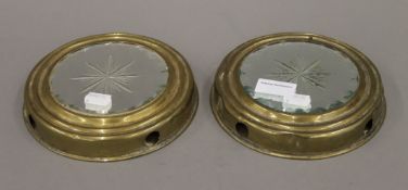 A pair of brass framed sorcerer's mirrors. 17.5 cm diameter.