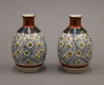 A pair of small Oriental pottery vases. 11.5 cm high.