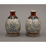 A pair of small Oriental pottery vases. 11.5 cm high.