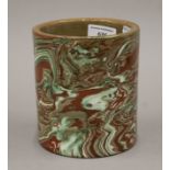 A Chinese ceramic brush pot with marbled glaze. 13.5 cm high.