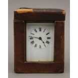 A brass carriage clock, with key, in original carrying case. The case 12.5 cm high .