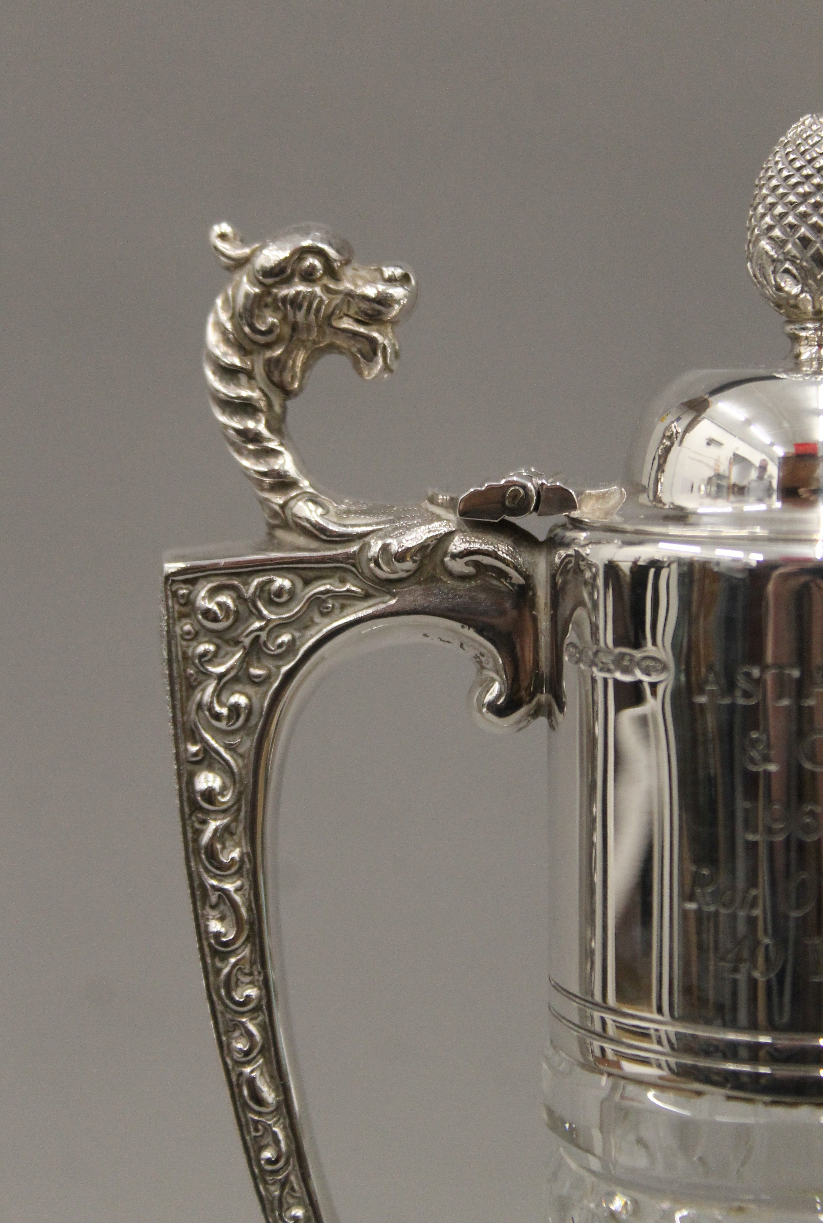 A pair of silver mounted cut glass claret jugs. 30.5 cm high. - Image 5 of 6