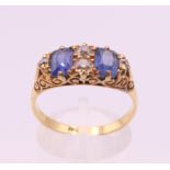 A 15 ct gold diamond and sapphire ring. Ring size R/S.