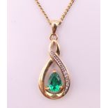 A 9 ct gold pendant on chain. Pendant 3 cm high including suspension loop, chain 44 cm long. 3.