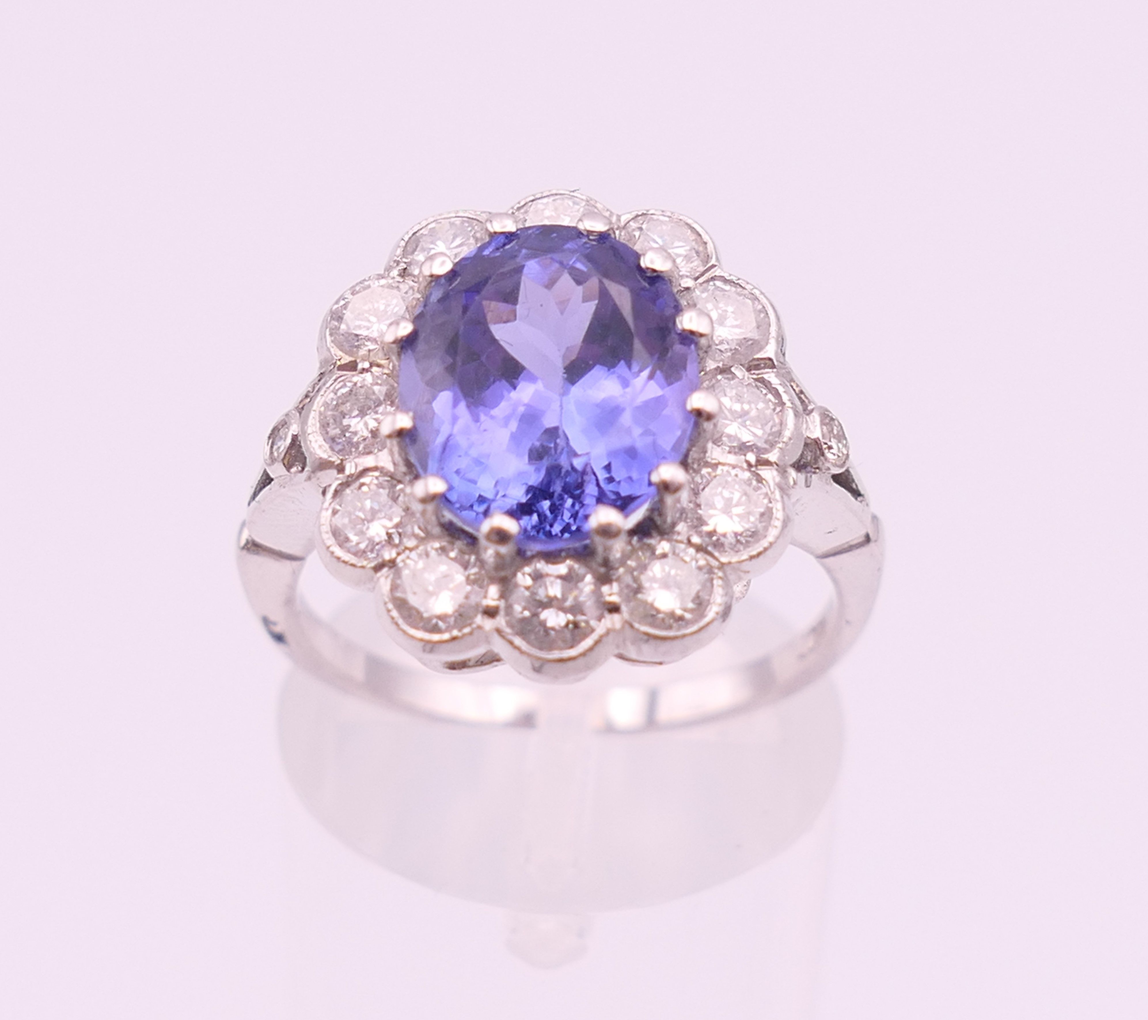 An 18 ct white gold ring with central tanzanite of 2. - Image 3 of 8