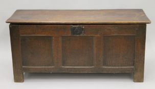 An 18th century oak three panel coffer. 120 cm long.