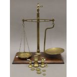 A Victorian set of brass scales. 39 cm wide.
