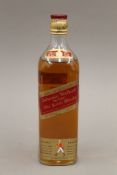 A single bottle of Johnnie Walker Red Label Old Scotch Whisky. 27 cm high.