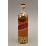 A single bottle of Johnnie Walker Red Label Old Scotch Whisky. 27 cm high.