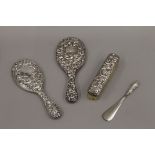 A silver backed dressing table set.