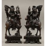 A pair of late 19th/early 20th century Chinese hardwood carvings depicting Guanyin riding a deer.