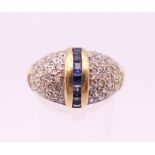 An 18 ct gold sapphire ring. Ring size P/Q. 5.6 grammes total weight.