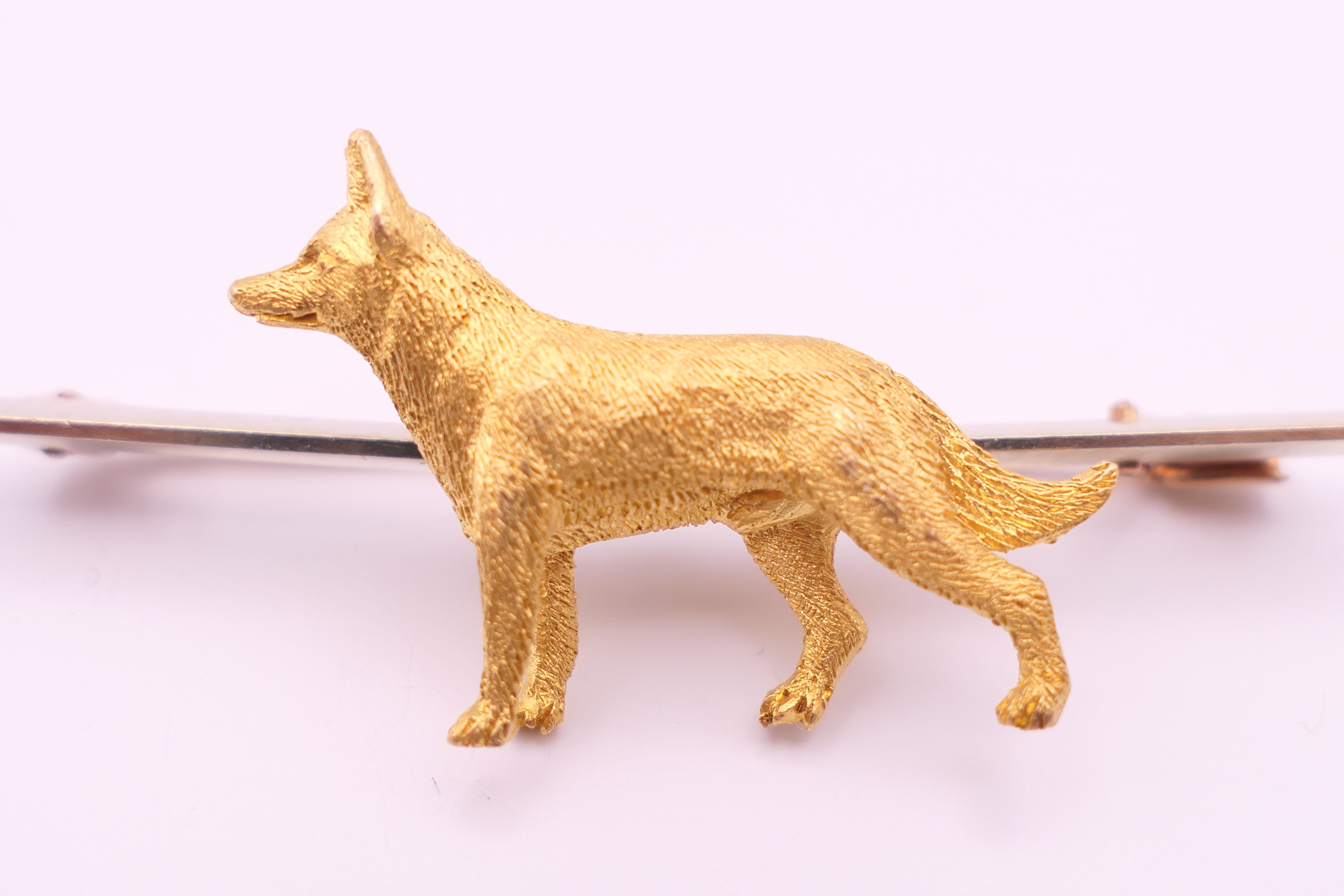 A 9 ct gold bar brooch, set with an unmarked 15 ct gold Alsatian. 5 cm long, dog 2.25 cm long. 7. - Image 4 of 9