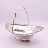 A silver basket. 18 cm long. 171.3 grammes.