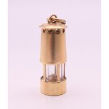 A 9 ct gold Davey Lamp miners lamp charm/pendant. 2 cm high. 2.4 grammes total weight.