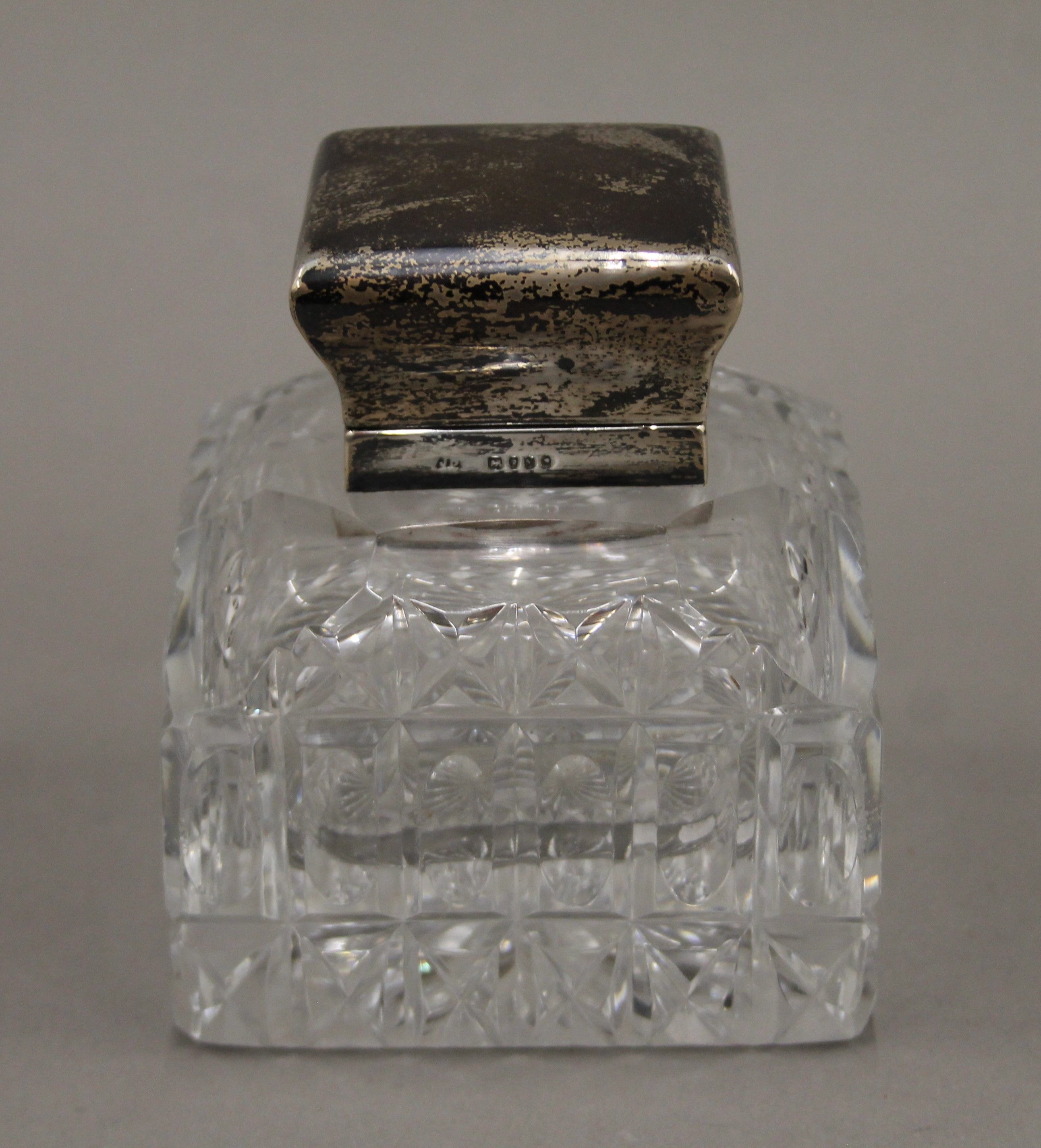 A silver mounted inkwell, hallmarked for 1887, makers mark John Brashier. 10.5 cm high.