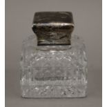 A silver mounted inkwell, hallmarked for 1887, makers mark John Brashier. 10.5 cm high.