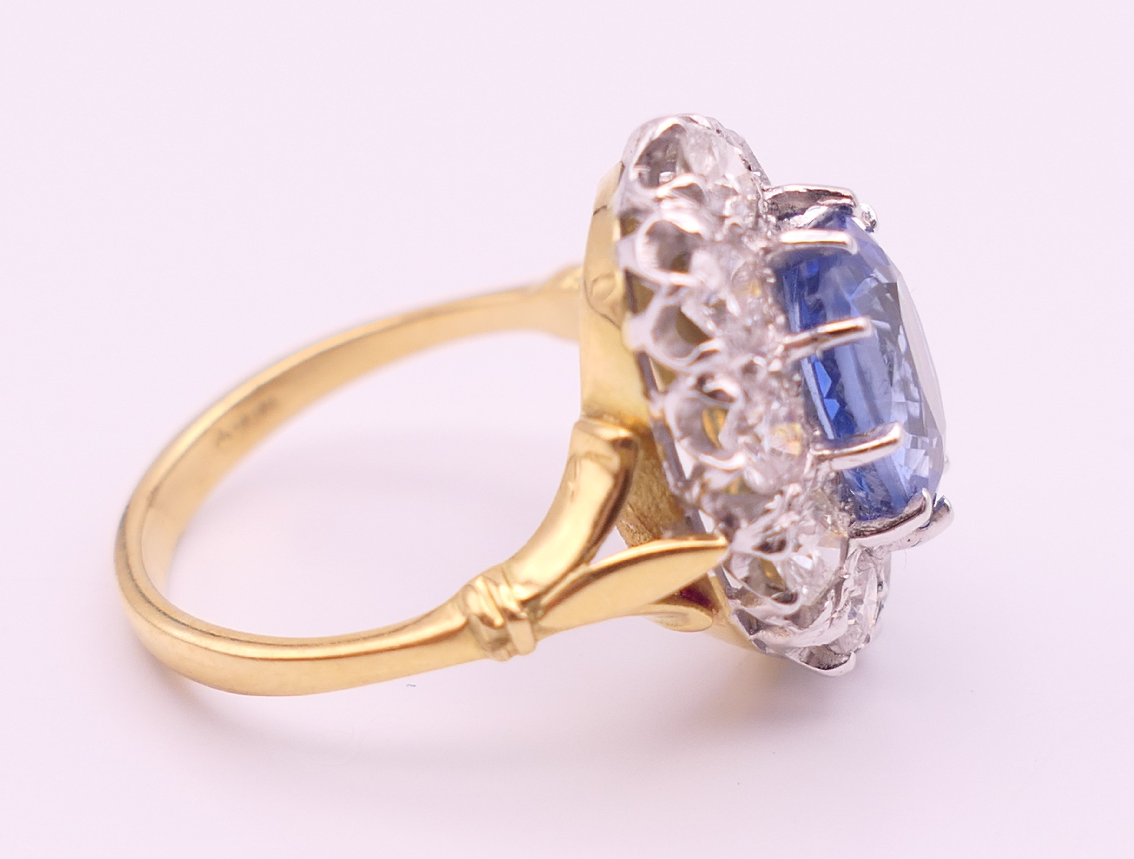 An 18 ct gold and platinum diamond and sapphire ring. - Image 2 of 9