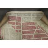 A rolled London Insurance Plan, partly coloured laid down on canvas by Edward Stanford,