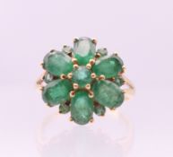 A 14 ct gold and emerald ring. Ring size Q.