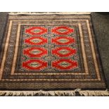 A Middle Eastern rug. 96 x 91.5 cm.