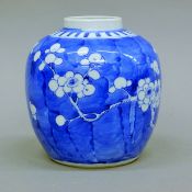 A Chinese blue and white prunus pattern ginger jar, with four character mark to base.
