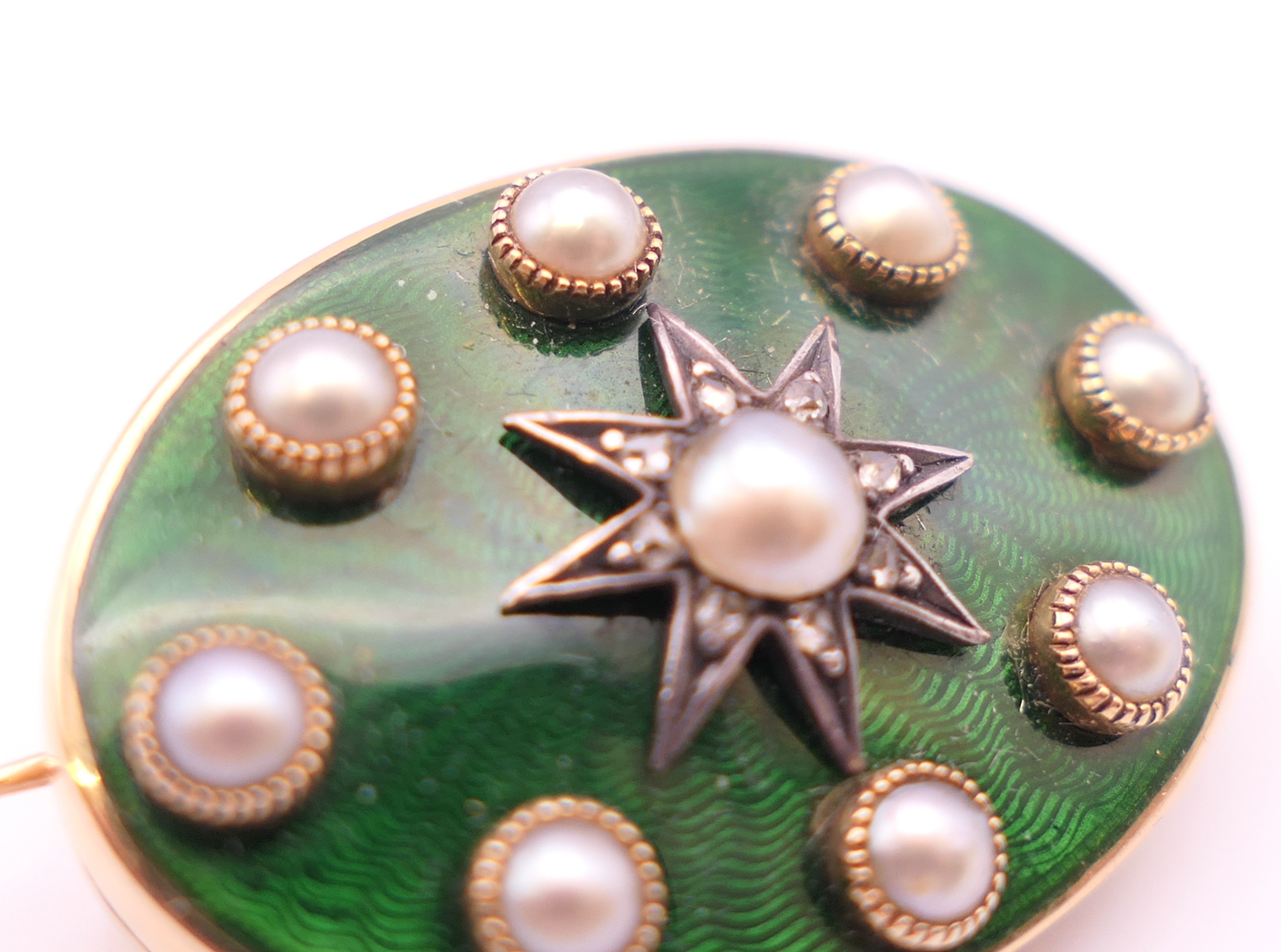 A gold, pearl and green enamel brooch, cased. 2.5 cm x 1.75 cm. 7.9 grammes total weight. - Image 5 of 10